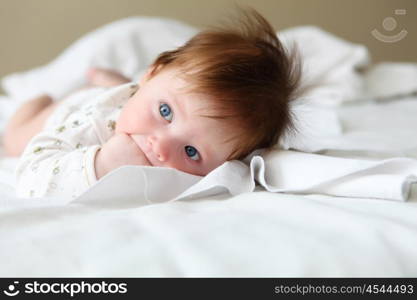 portrait of beautuful redhair infant with blue eyes