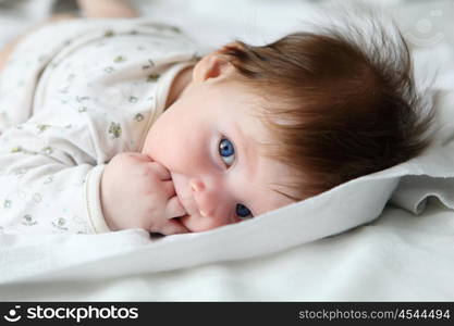 portrait of beautuful redhair infant with blue eyes