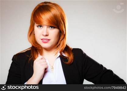 Portrait of beauty redhair business woman or student girl. Studio shot on gray background