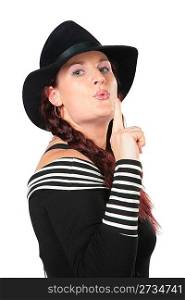 Portrait of beauty woman in black hat makes gesture smoking gun by finger