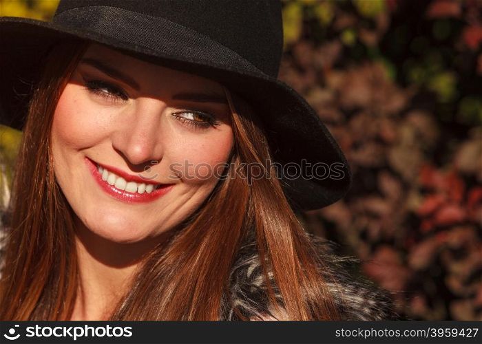 Portrait of beauty woman in hat. Gorgeous stylish young woman wearing fashionable clothes. Portrait of girl in black hat outside.