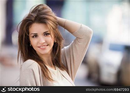 Portrait of beauty woman with perfect smile walking on the street and looking at camera. Portrait of beauty woman with perfect smile walking on the street and looking at camera.