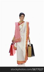 Portrait of Bengali woman carrying shopping bags