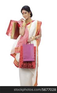 Portrait of Bengali woman carrying shopping bags