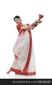 Portrait of Bengali woman doing Dhunuchi dance