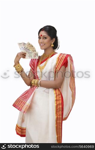 Portrait of Bengali woman holding currency notes