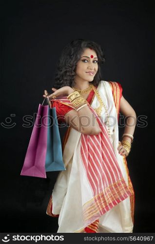 Portrait of bengali woman holding shopping bags