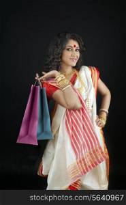 Portrait of bengali woman holding shopping bags
