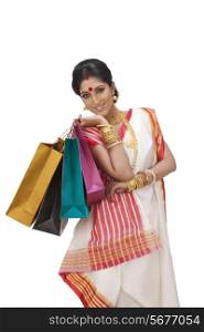 Portrait of Bengali woman holding shopping bags