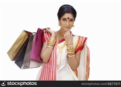 Portrait of Bengali woman holding shopping bags
