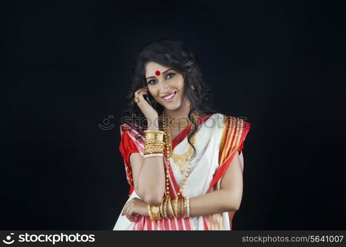 Portrait of Bengali woman talking on a mobile phone