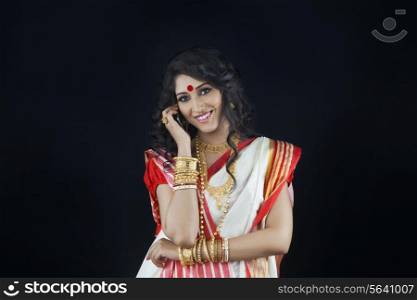 Portrait of Bengali woman talking on a mobile phone