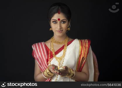 Portrait of Bengali woman with diya