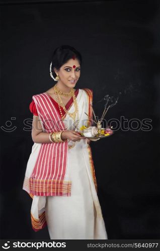 Portrait of Bengali woman with puja thali