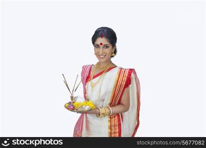 Portrait of Bengali woman with puja thali