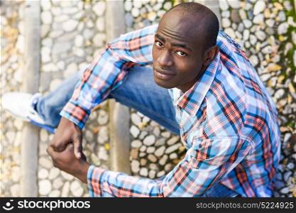 Portrait of black man wearing casual clothes in urban background