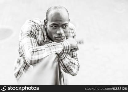 Portrait of black man wearing casual clothes in urban background