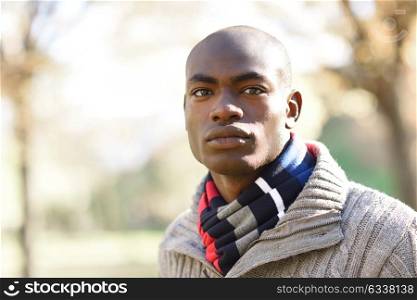 Portrait of black man wearing casual clothes in urban background