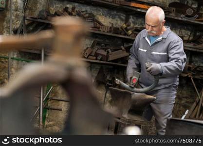 portrait of blacksmith at work