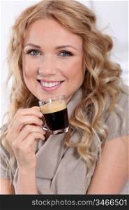 Portrait of blond woman drinking expresso