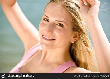 Portrait of blond woman enjoy summer sun at sea