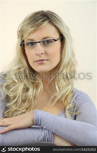 Portrait of blond woman wearing glasses