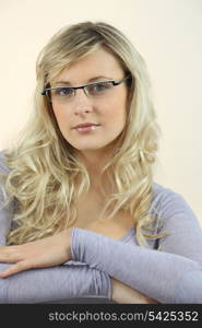 Portrait of blond woman wearing glasses