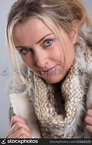 Portrait of blond woman wearing winter jacket