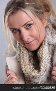 Portrait of blond woman wearing winter jacket
