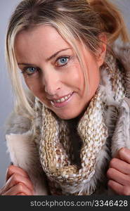 Portrait of blond woman wearing winter jacket