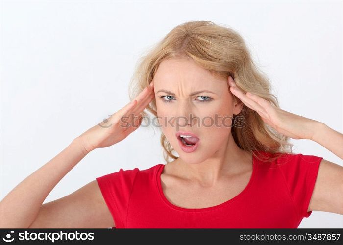 Portrait of blond woman with horrified look