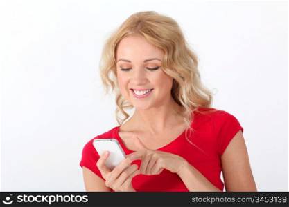 Portrait of blond woman with red shirt writing short message
