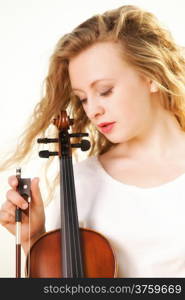 Portrait of blonde girl music lover on beach with a violin. Love of music concept.