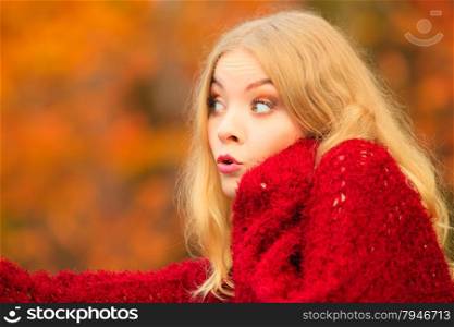 Portrait of blonde woman outdoor. Funny cute girl having fun surprised face emotion