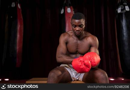 Portrait of boxer preparing to fight on stage to gain experience in the use of Muay Thai martial arts