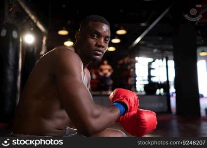 Portrait of boxer preparing to fight on stage to gain experience in the use of Muay Thai martial arts
