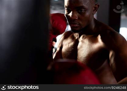 Portrait of boxers must practice their kicking and punching skills with punching bag. To build strength and power of kicking and punching.