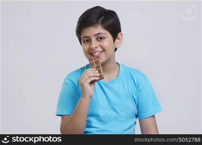 Portrait of boy eating chocolate