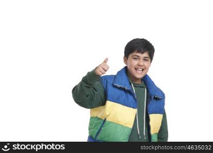 Portrait of boy giving thumbs up