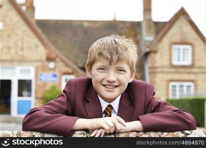 Portrait Of Boy In Uniform Outside School Building