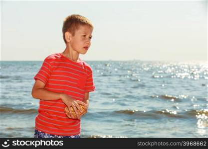 Portrait of boy outdoor in summer time.. Leisure and free time concept. Portrait of little boy spending time outside on fresh air. Male kid outdoor on holidays vacation.