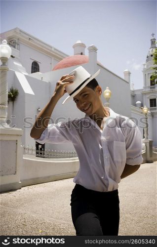 Portrait of boy wearing Plena traditional attire, outdoors