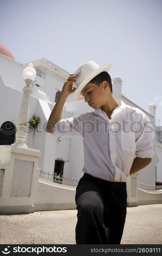 Portrait of boy wearing Plena traditional attire, outdoors