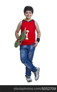Portrait of boy with skateboard