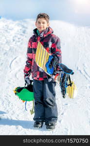 Portrait of Boy with Snowboard