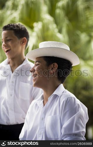 Portrait of boys in traditional Plena attire, outdoors