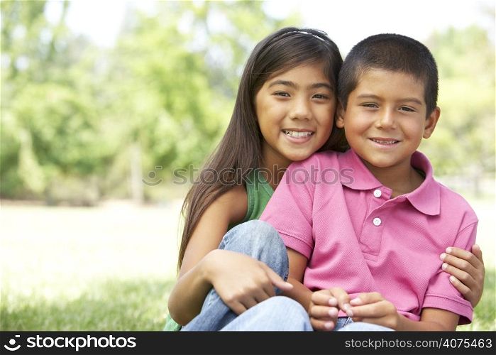 Portrait Of Brother And Sister In Park