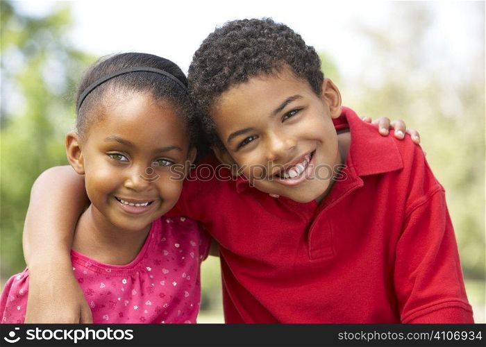 Portrait Of Brother And Sister In Park