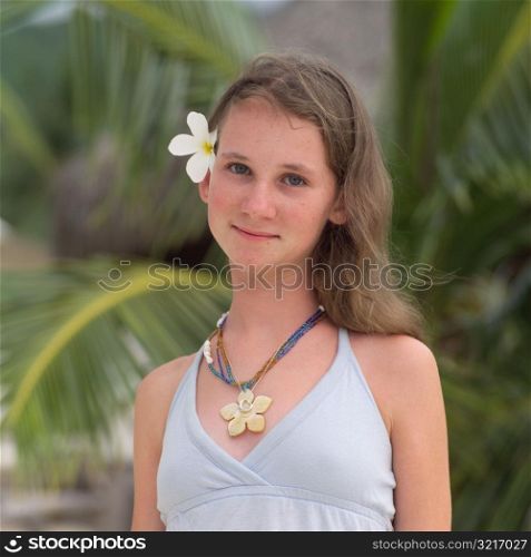 Portrait of Brunette with Flower in Her Hair at Moorea in Tahiti