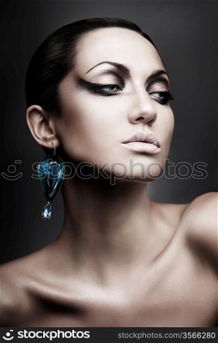 portrait of brunette woman with diamond earring